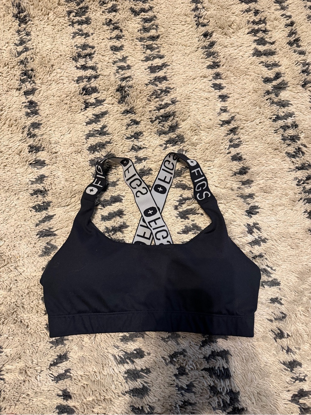 black FIGS Performance Underscrub Sports Bra featuring branded crossback straps - Picture 3 of 4